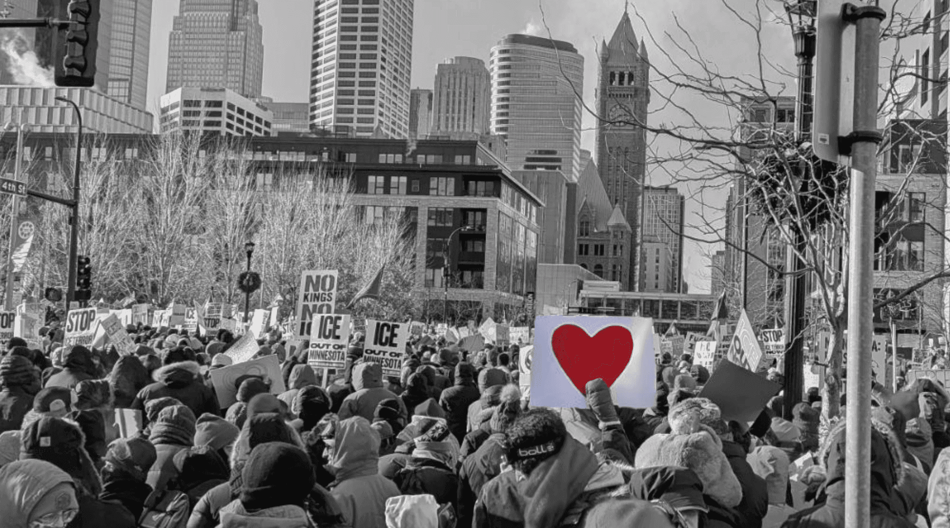 Minnesota community protest - crowd with heart sign and resistance signs